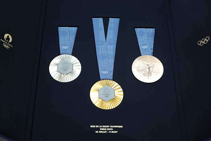 Paris Olympic medals display against a dark background. Paris Olympic medals display against a dark background.