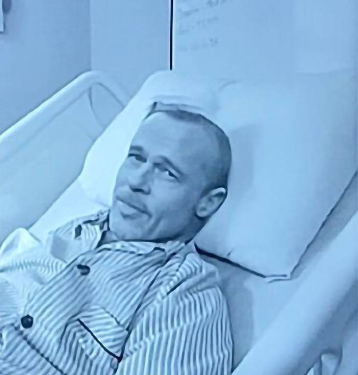 AI image of Brad Pitt in striped pajamas lying in a bed. AI image of Brad Pitt in striped pajamas lying in a bed.