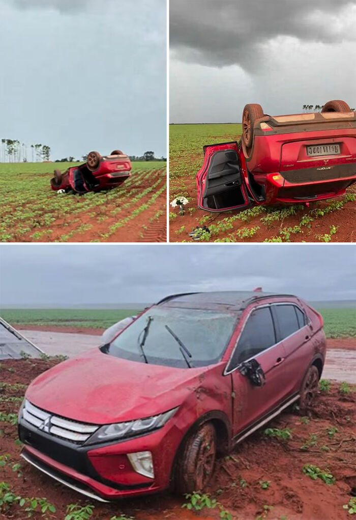 Overturned red car on a dirt field, capturing the scene of an accident. Overturned red car on a dirt field, capturing the scene of an accident.
