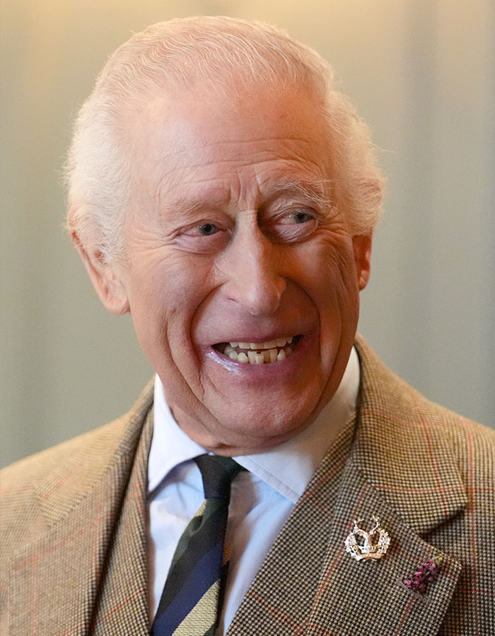 Smiling elderly man in a suit, related to dentist shortage discussion in the UK. Smiling elderly man in a suit, related to dentist shortage discussion in the UK.