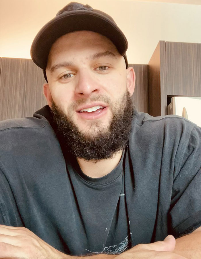 Man in a casual cap and beard, discussing bachelorette parties from a male stripper's perspective. Man in a casual cap and beard, discussing bachelorette parties from a male stripper's perspective.