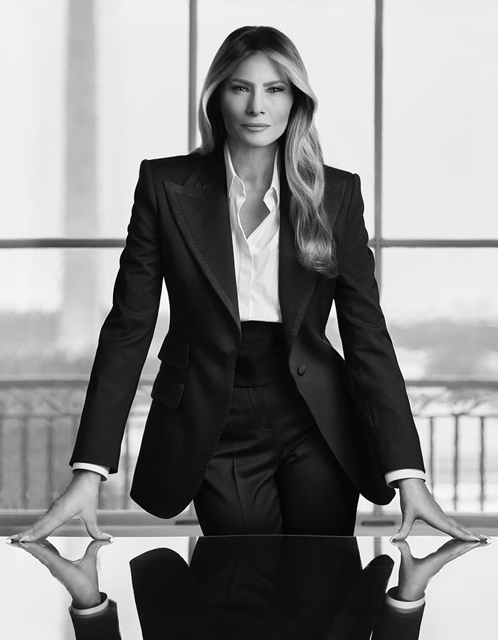 Elegant woman in a black suit in a professional setting, related to freelance magician. Elegant woman in a black suit in a professional setting, related to freelance magician.