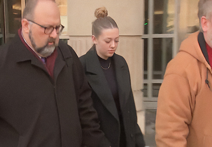 College students involved in kidnapping soldier case, walking outside a building. College students involved in kidnapping soldier case, walking outside a building.