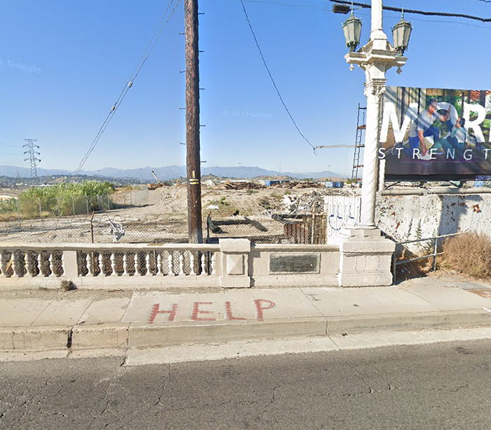 Mysterious "Help" sign on sidewalk in urban area, viewed on Google Earth. Mysterious "Help" sign on sidewalk in urban area, viewed on Google Earth.