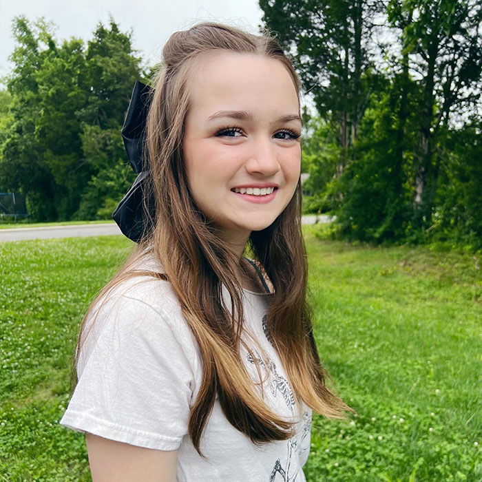 Smiling girl outdoors, related to the Side-Eyeing Chloe meme from 12 years ago. Smiling girl outdoors, related to the Side-Eyeing Chloe meme from 12 years ago.