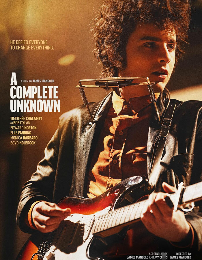 Timothée Chalamet as Bob Dylan in "A Complete Unknown," holding a guitar. Timothée Chalamet as Bob Dylan in "A Complete Unknown," holding a guitar.