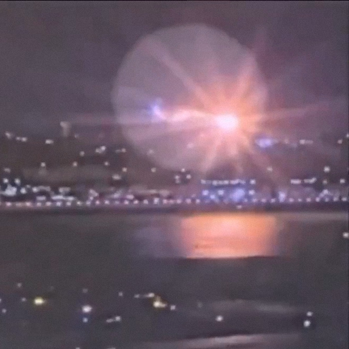 Blurry night scene of city lights reflecting on water after DC crash, highlighting airport safety concerns. Blurry night scene of city lights reflecting on water after DC crash, highlighting airport safety concerns.