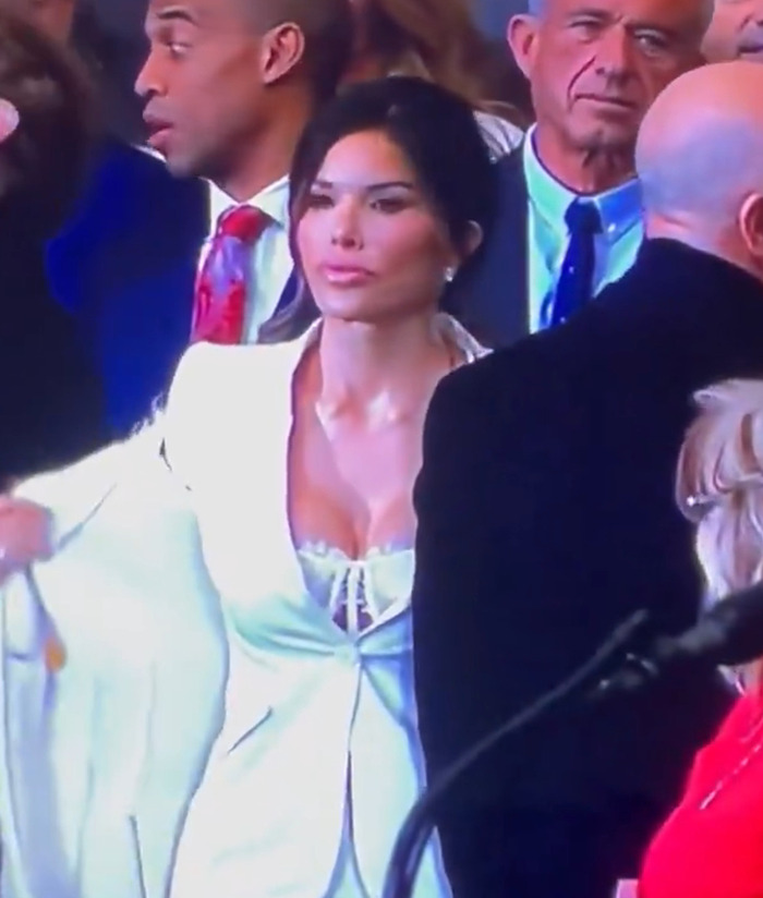 Lauren Sanchez wearing a white outfit at an event, sparking discussions about her attire. Lauren Sanchez wearing a white outfit at an event, sparking discussions about her attire.