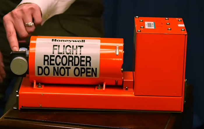 Flight recorder being examined. Flight recorder being examined.