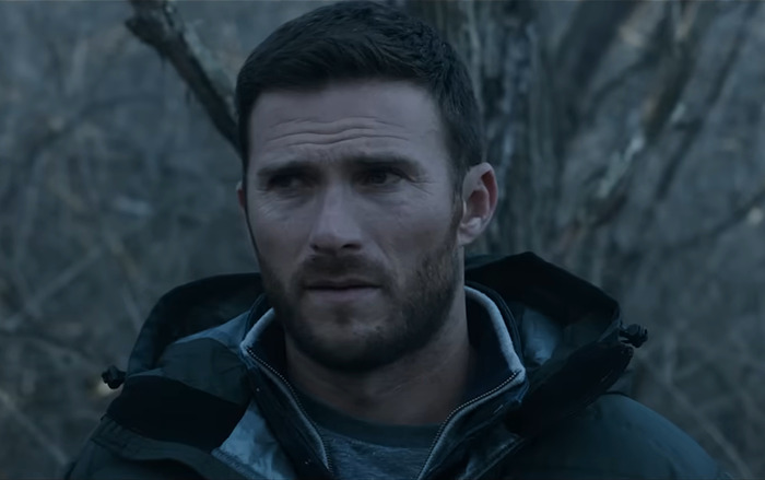 Clint Eastwood's son appears thoughtful in a forest setting. Clint Eastwood's son appears thoughtful in a forest setting.