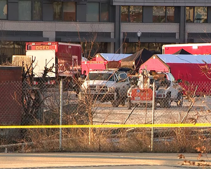 Emergency vehicles and tents at the scene of a DC American Airlines plane crash. Emergency vehicles and tents at the scene of a DC American Airlines plane crash.