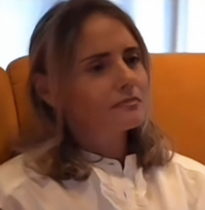 Woman affected by Fake AI Brad Pitt scam sits on a yellow sofa, reflecting on financial fraud. Woman affected by Fake AI Brad Pitt scam sits on a yellow sofa, reflecting on financial fraud.