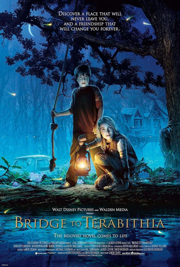 "Bridge to Terabithia" movie poster with two kids holding a lantern in a mystical forest, evoking a tear-jerking atmosphere.