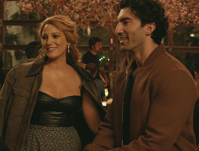 Two people enjoying an evening out, set against a warm, intimate restaurant backdrop. Two people enjoying an evening out, set against a warm, intimate restaurant backdrop.