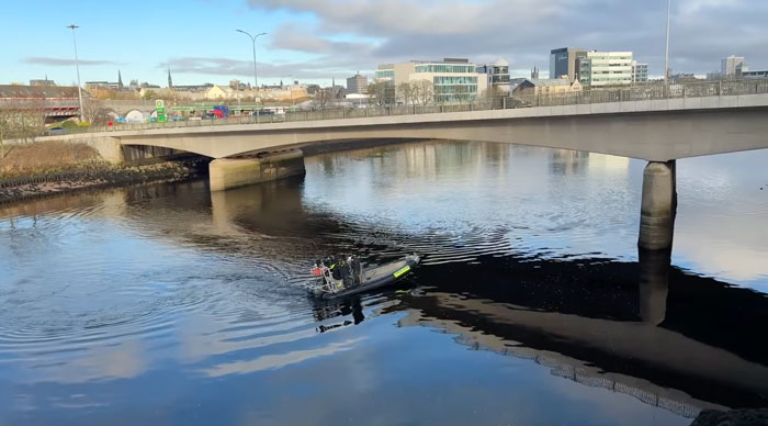 Boat searching river under bridge in hunt for missing sisters who disappeared weeks ago. Boat searching river under bridge in hunt for missing sisters who disappeared weeks ago.