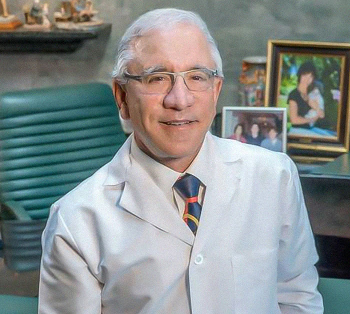 Dr. Guyuron in a white lab coat and glasses, sitting in an office; study on face impacts of divorce and bad diet discussed. Dr. Guyuron in a white lab coat and glasses, sitting in an office; study on face impacts of divorce and bad diet discussed.
