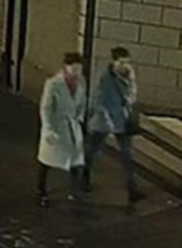 Two sisters walking at night before disappearing, caught on street camera. Two sisters walking at night before disappearing, caught on street camera.