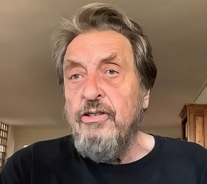 Older man with a beard in a casual home setting, related to Elon Musk's dad and wealth influence. Older man with a beard in a casual home setting, related to Elon Musk's dad and wealth influence.