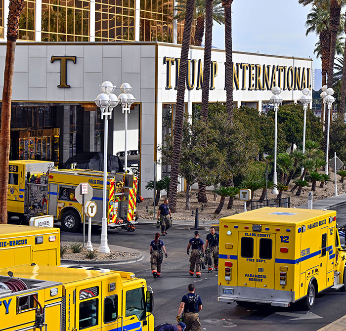 Emergency vehicles at building entrance after Cybertruck explosion incident. Emergency vehicles at building entrance after Cybertruck explosion incident.