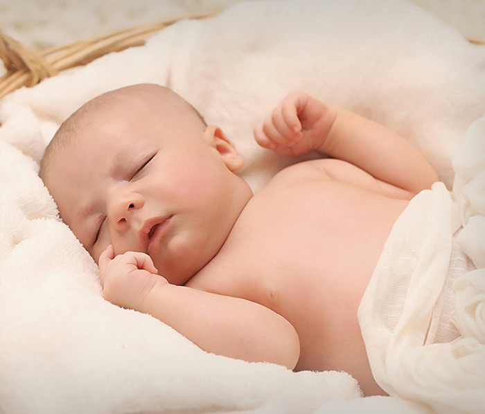 Sleeping baby wrapped in a blanket, representing Generation Beta. Sleeping baby wrapped in a blanket, representing Generation Beta.