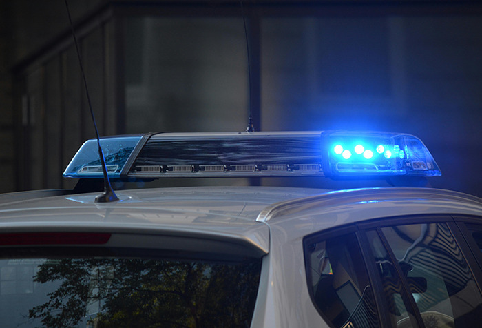 Police car with blue lights flashing, representing a woman's disappearance and Google Maps aiding in closure. Police car with blue lights flashing, representing a woman's disappearance and Google Maps aiding in closure.