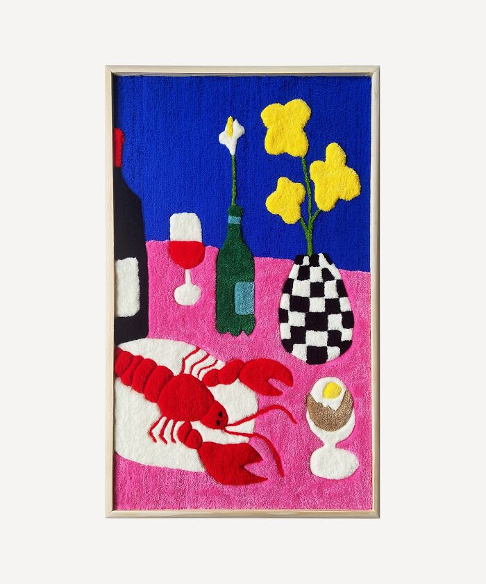Vibrant tufted artwork featuring a lobster, wine bottles, flowers, and an egg, set against a colorful background.
