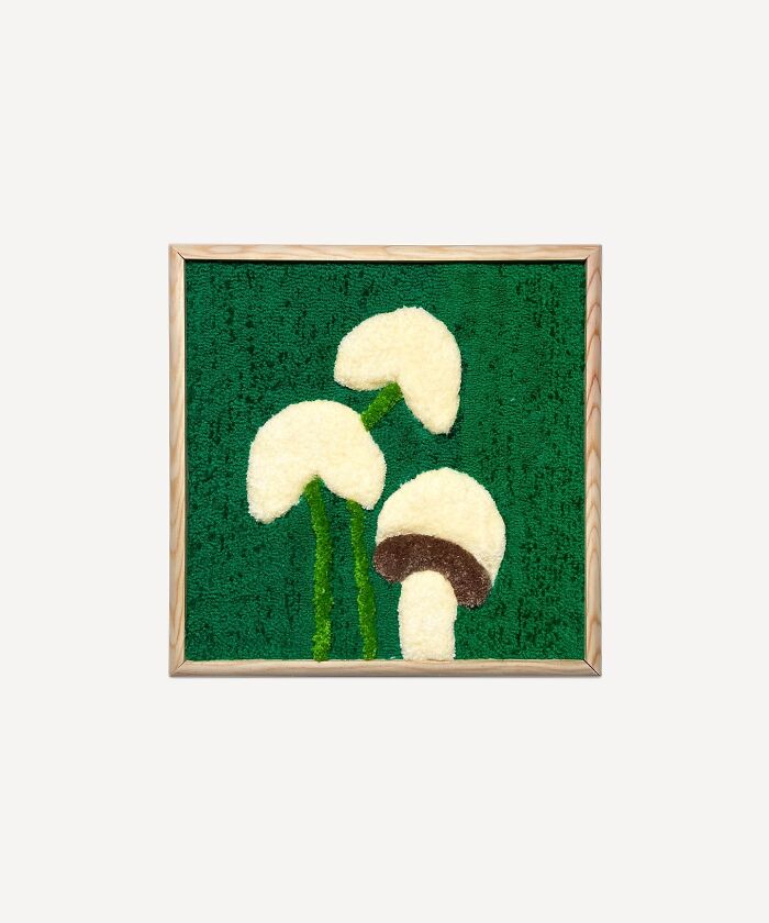 Tufted artwork featuring mushrooms on a green background.