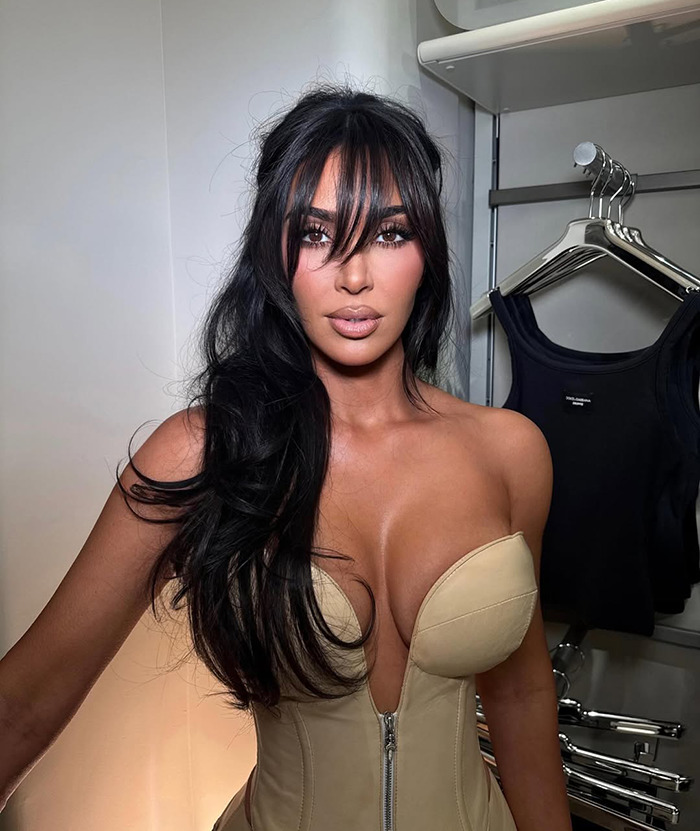 Kim Kardashian posing for a picture indoors wearing beige top. Kim Kardashian posing for a picture indoors wearing beige top.