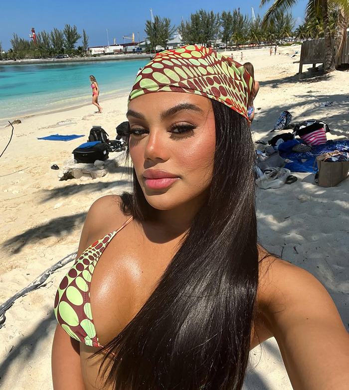 Kaya Odom on a tropical beach in a patterned bikini. Kaya Odom on a tropical beach in a patterned bikini.