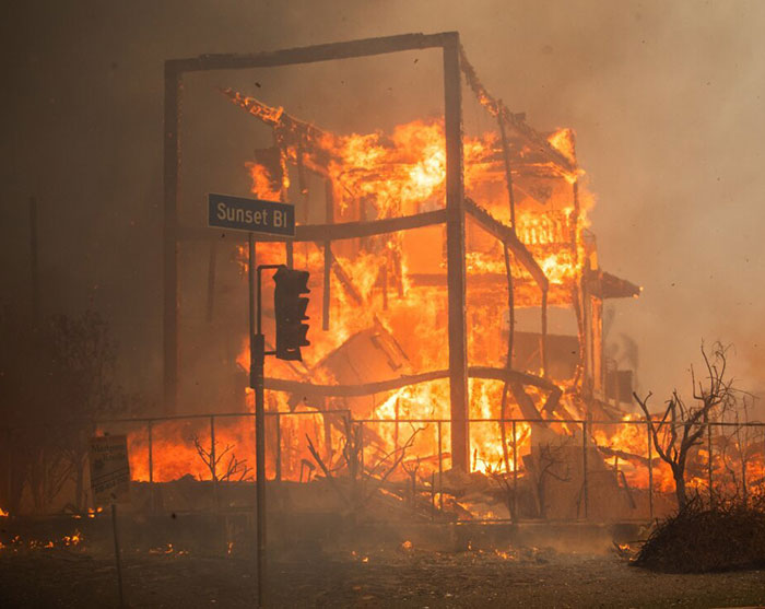 Wildfire consuming structure on Sunset Blvd in LA, highlighting tragedy causes. Wildfire consuming structure on Sunset Blvd in LA, highlighting tragedy causes.