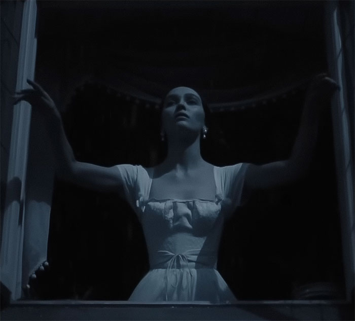Image of an actress in a vintage dress, arms outstretched, in a dark, dramatic setting related to Nosferatu audition. Image of an actress in a vintage dress, arms outstretched, in a dark, dramatic setting related to Nosferatu audition.