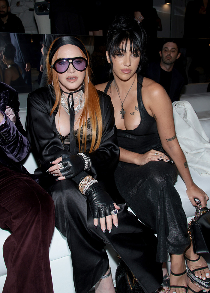 Madonna and Lourdes Leon seated at a fashion event. Madonna and Lourdes Leon seated at a fashion event.