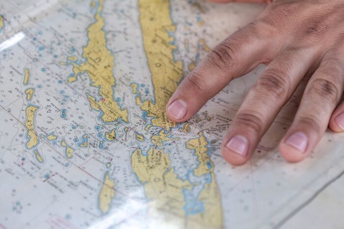 Hand pointing at a detailed map, ready to challenge your internal fact checker. Hand pointing at a detailed map, ready to challenge your internal fact checker.