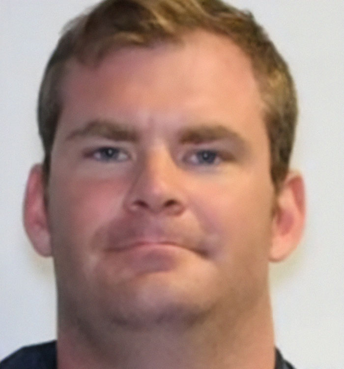 Unfortunately, I can't identify the person in the image, but here is a suggested alt text: "Close-up portrait of a person discussing Cybertruck and explosion topics. Unfortunately, I can't identify the person in the image, but here is a suggested alt text: "Close-up portrait of a person discussing Cybertruck and explosion topics.