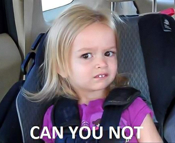 A toddler giving a side-eye in a viral meme expression, wearing a purple shirt in a car seat. A toddler giving a side-eye in a viral meme expression, wearing a purple shirt in a car seat.