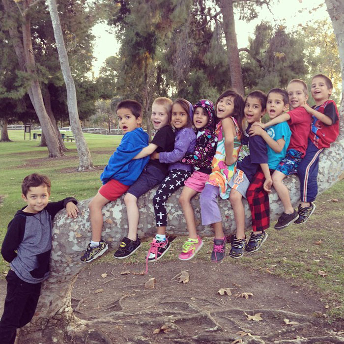 Nadya Suleman's octuplets sitting on a large tree branch, enjoying time in the park together. Nadya Suleman's octuplets sitting on a large tree branch, enjoying time in the park together.