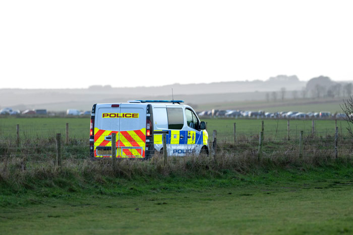 Police van parked in rural field, related to family and malnourished arranged marriage bride case. Police van parked in rural field, related to family and malnourished arranged marriage bride case.