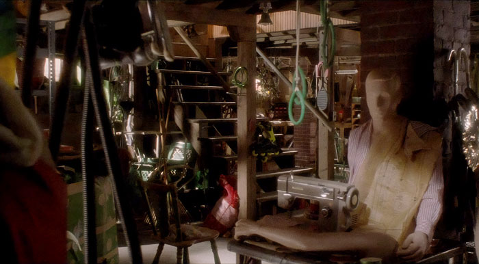 Cold, dingy basement with mannequins and sewing supplies scattered around, dimly lit atmosphere. Cold, dingy basement with mannequins and sewing supplies scattered around, dimly lit atmosphere.