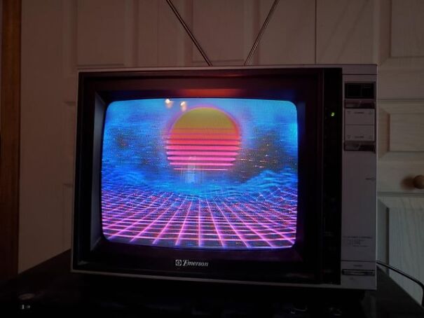 Retro Emerson TV displaying a vibrant sunset with neon gridlines, evoking nostalgia for the good old days.