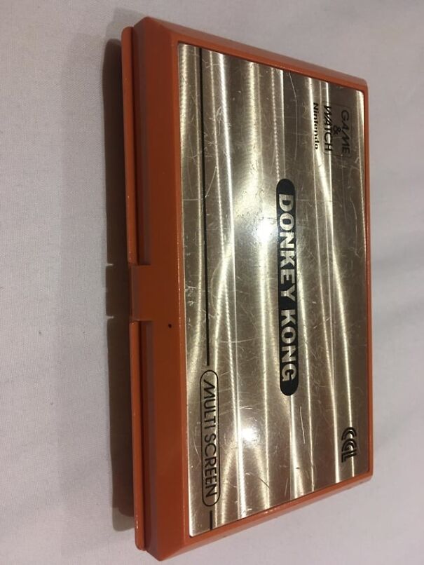 Retro Donkey Kong Game & Watch console with orange casing, evoking nostalgia for the good old days.