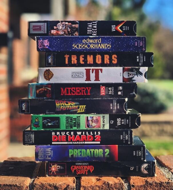 Stack of retro VHS tapes, including titles like "Total Recall," evoking sentimental nostalgia for the good old days.