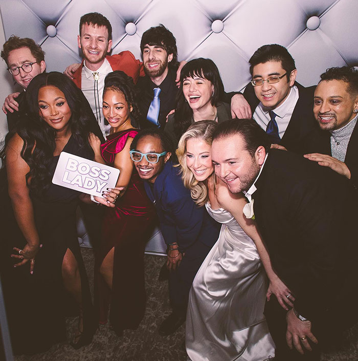 Group photo at a wedding with former child stars from School of Rock, smiling and posing together in formal attire. Group photo at a wedding with former child stars from School of Rock, smiling and posing together in formal attire.