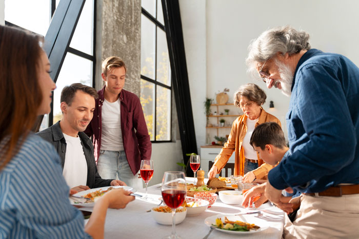 Family gathered around a dining table, reflecting on fixing attitudes and relationships. Family gathered around a dining table, reflecting on fixing attitudes and relationships.