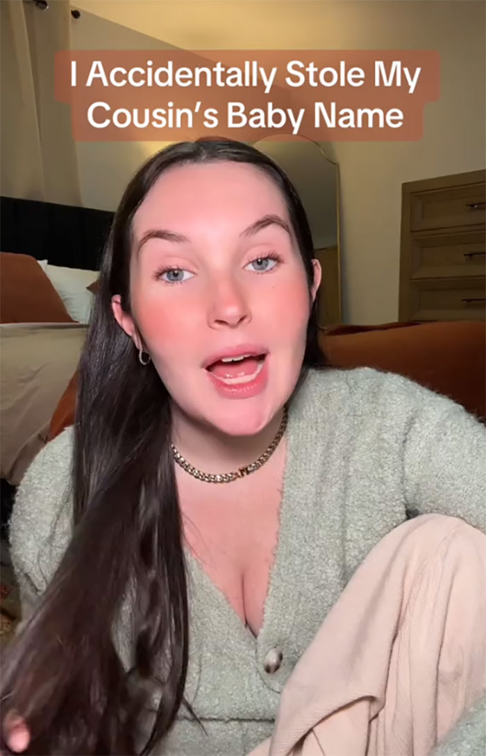 Woman discusses accidentally naming her dog Pearl, her cousin's baby's name, in a cozy room setting. Woman discusses accidentally naming her dog Pearl, her cousin's baby's name, in a cozy room setting.