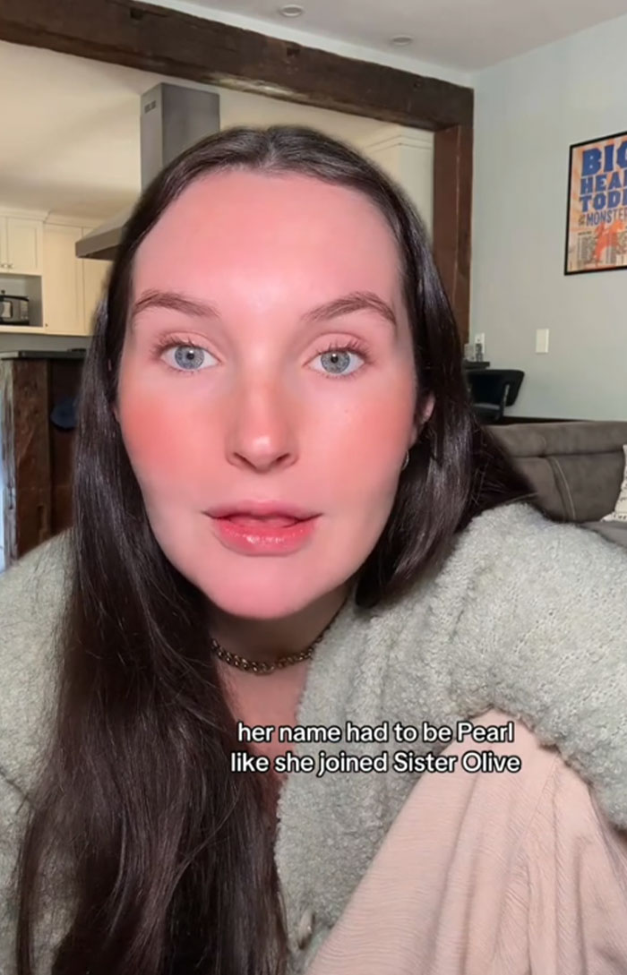 Woman discussing baby name Pearl for her dog in a casual indoor setting. Woman discussing baby name Pearl for her dog in a casual indoor setting.