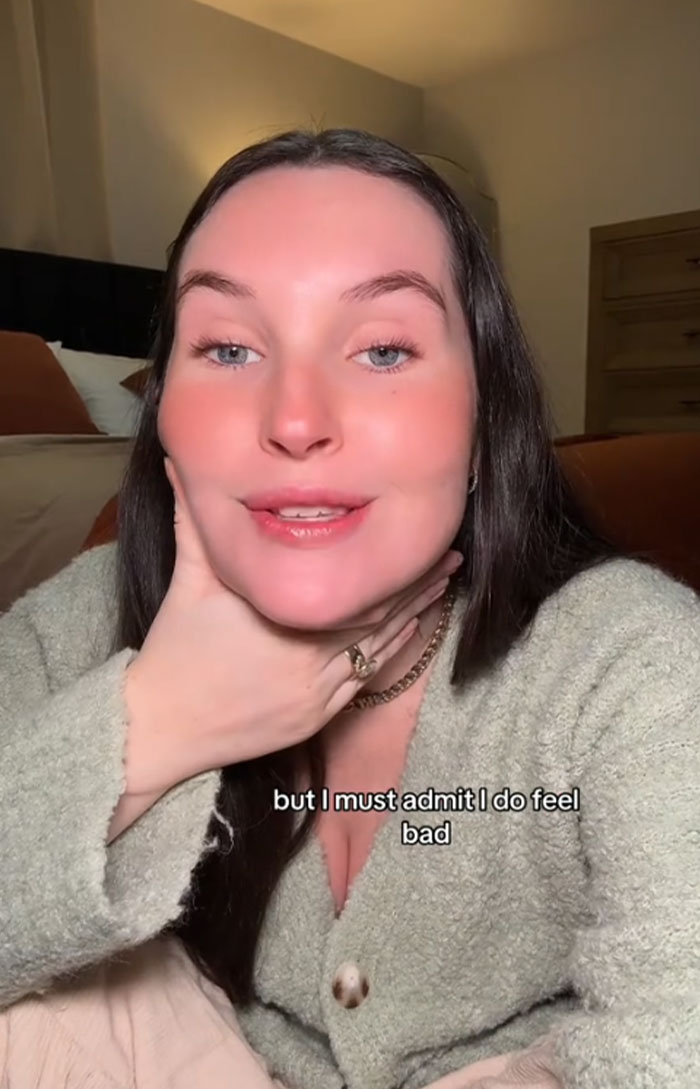 Woman discussing accidentally choosing baby’s name, Pearl, for her dog in a cozy room setting. Woman discussing accidentally choosing baby’s name, Pearl, for her dog in a cozy room setting.