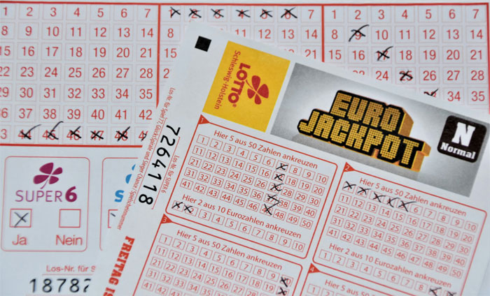 Euro Jackpot lottery ticket with winning numbers marked. Euro Jackpot lottery ticket with winning numbers marked.