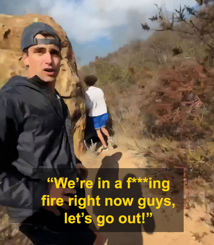 Young men filming near fire in La Palisades area. Young men filming near fire in La Palisades area.