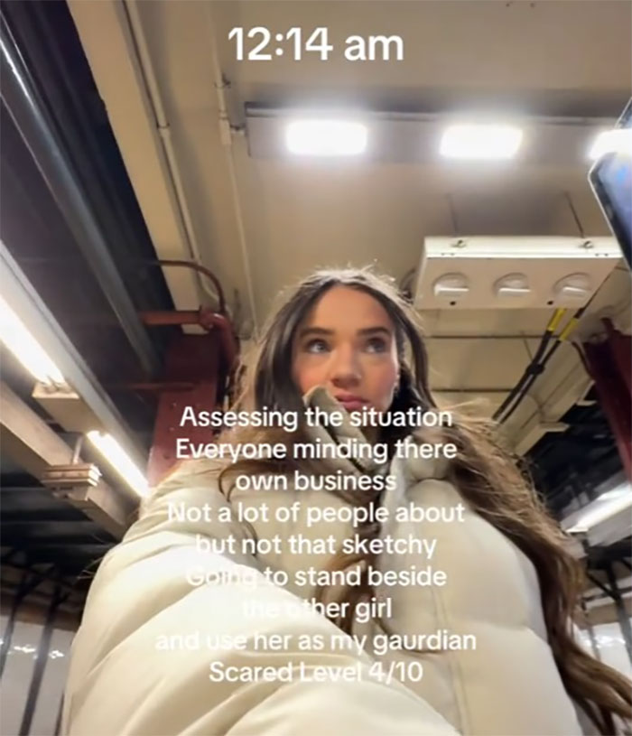 Woman in NYC subway at midnight, assessing "scared level" during walk home. Text overlay describes her thoughts. Woman in NYC subway at midnight, assessing "scared level" during walk home. Text overlay describes her thoughts.