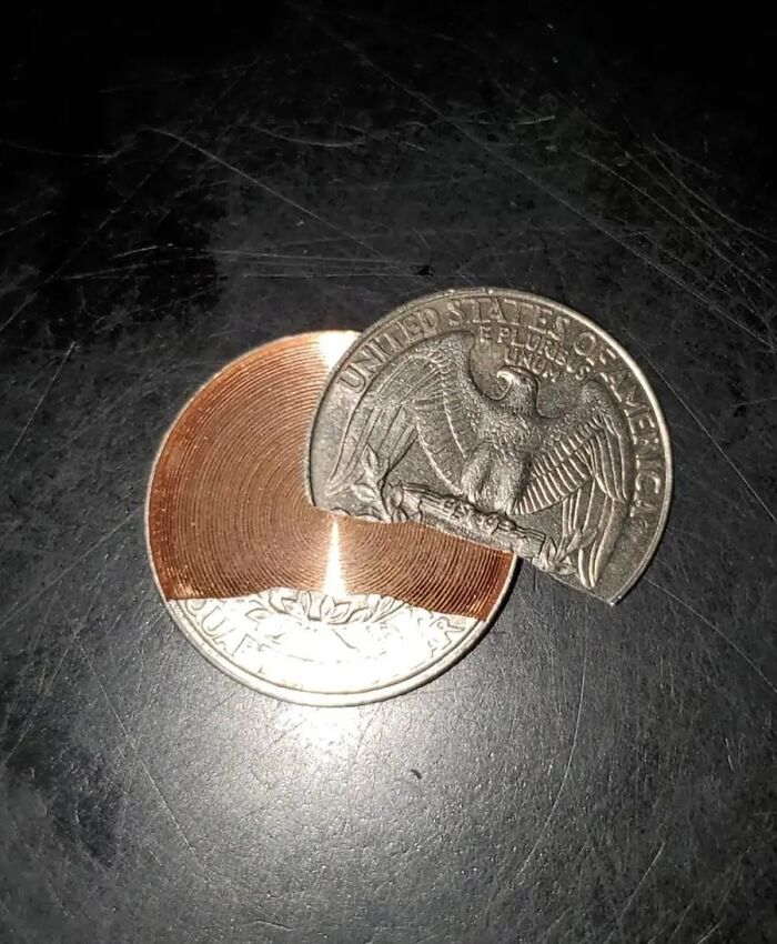 A coiled strip within a sliced-off coin, showcasing Interesting-Images-Cultureavenue creativity.